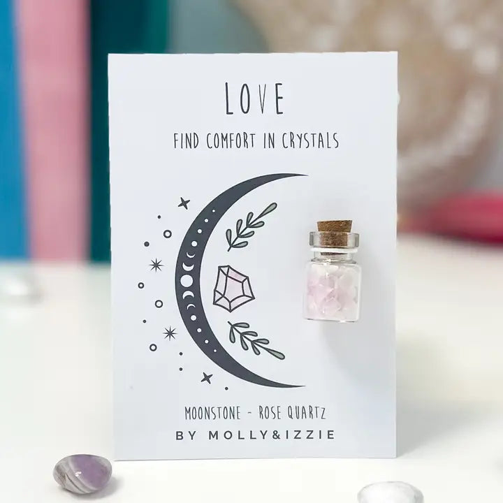 Product packaging with a crescent moon and crystal illustration on a white background