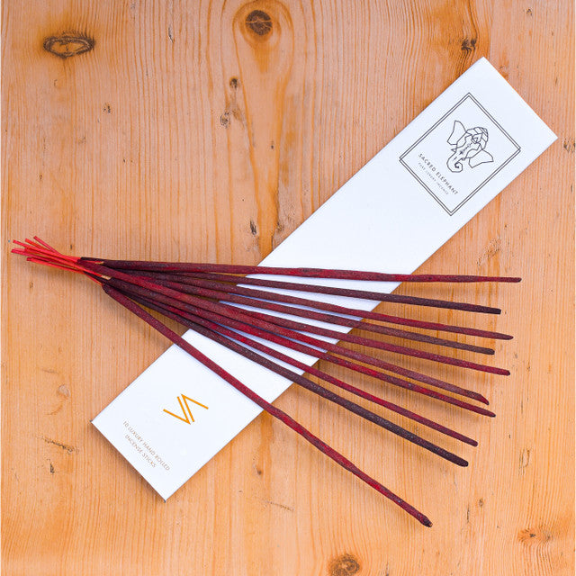 Incense sticks with packaging on a wooden surface