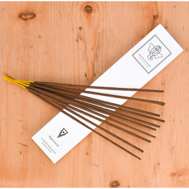 Incense sticks with packaging on a wooden surface