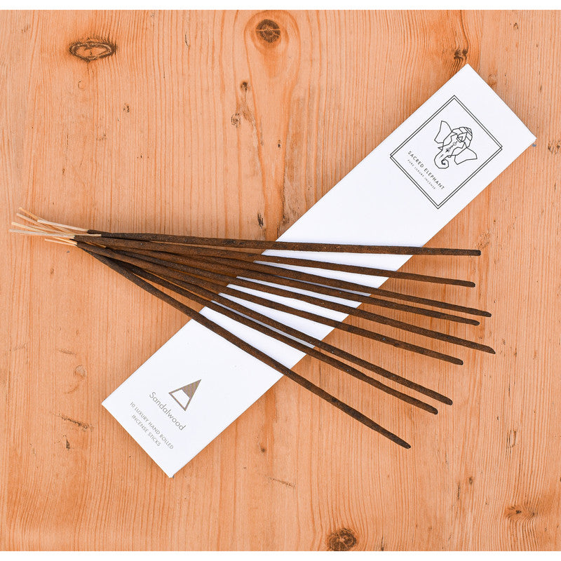 Incense sticks with packaging on a wooden surface