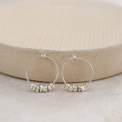 Earth and Elements Jewellery

https://www.earthandelements.co.uk › products › sterling-silver-nugget-hoops